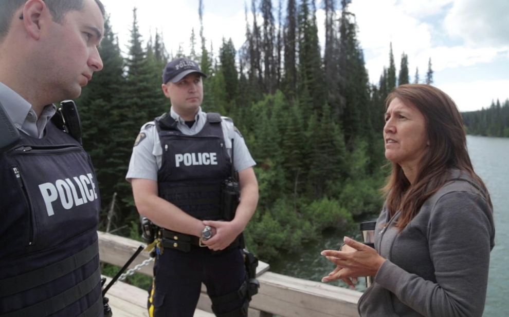 Freda Huson confronts RCMP officers on the bridge to traditional Unist’ot’en territory. Michael Toledano